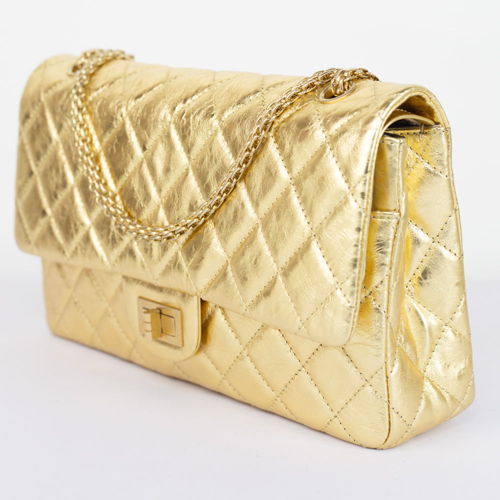 side view of Chanel Gold Reissue 227 Double Flap Bag