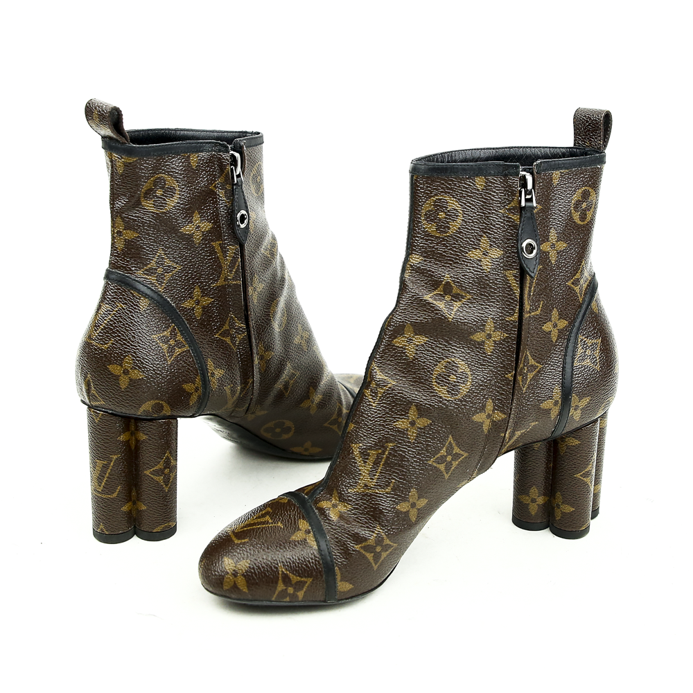 side zip view of Louis Vuitton Monogram Canvas New Revival Ankle Boots