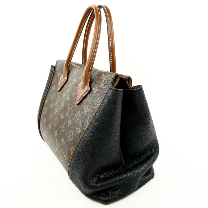 side view of Louis Vuitton Monogram Canvas & Black Leather W PM Bag