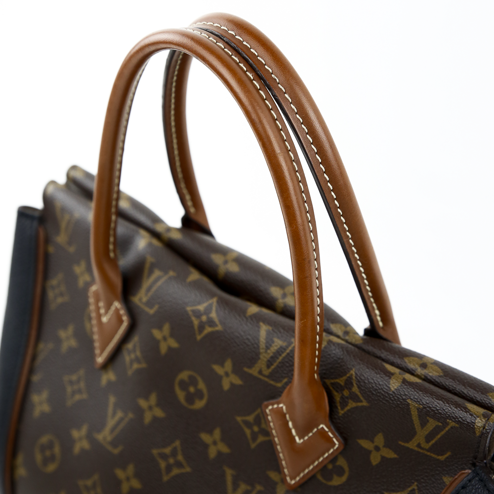 handle view of Louis Vuitton Monogram Canvas & Black Leather W PM Bag