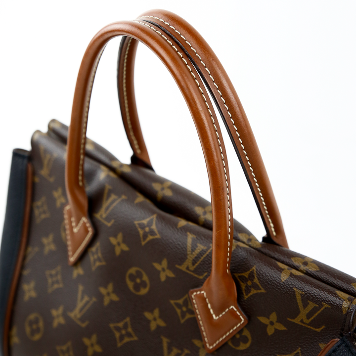 handle view of Louis Vuitton Monogram Canvas & Black Leather W PM Bag