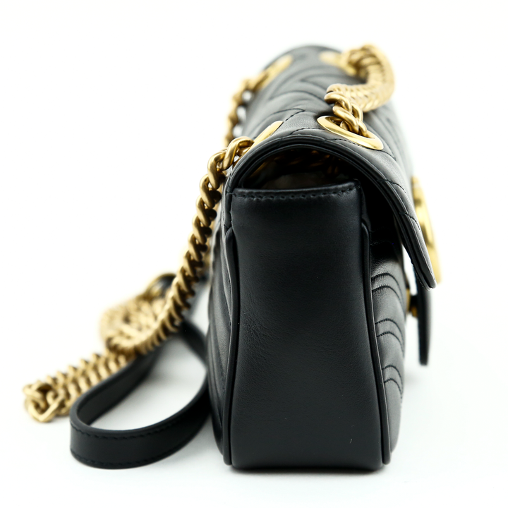 side view of Gucci Black GG Marmont Mini Matelasse Shoulder Bag