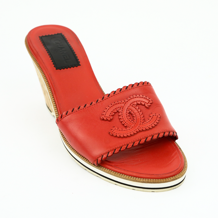 side view of Chanel Red Leather CC Cork Wedge Slides