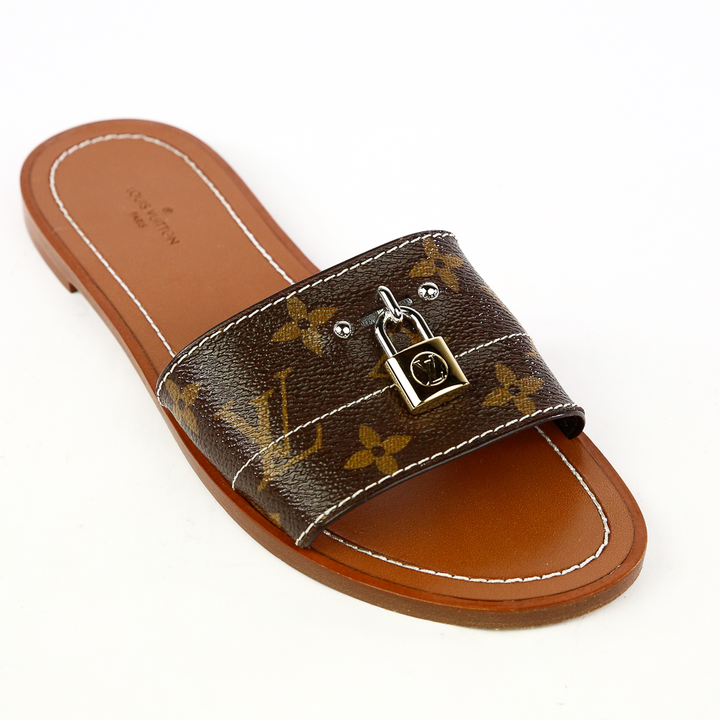 Side view of Louis Vuitton Lock It Monogram Canvas Slides