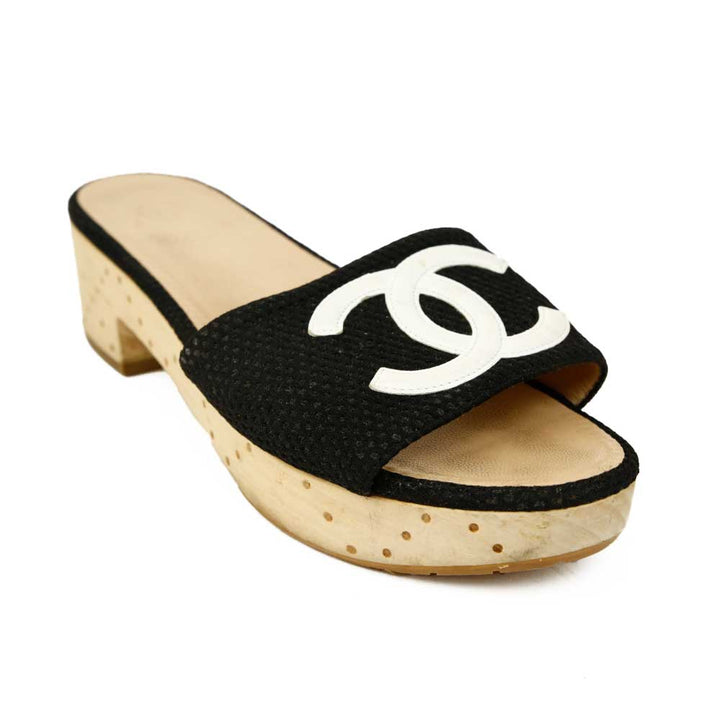 side view of Chanel Black Canvas CC Logo Wooden Slide Sandals