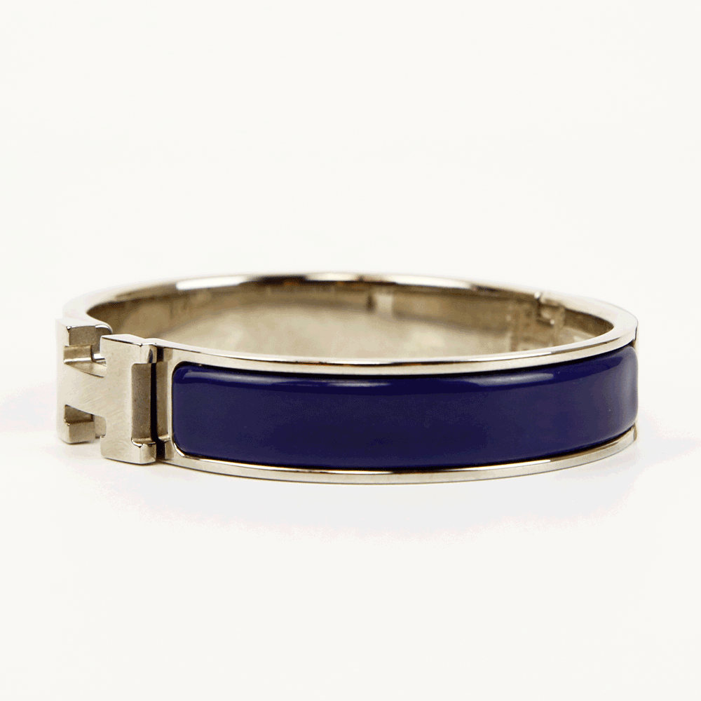 side view of Hermès Navy & Silver Clic H Bangle